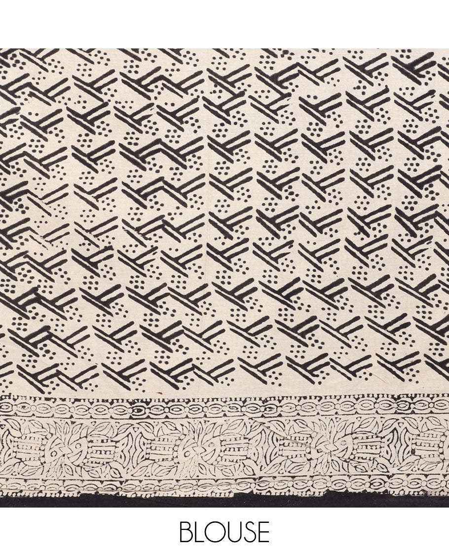 Black floral motifs printed mul-mul cotton saree, fish printed border & pallu of intricate print 