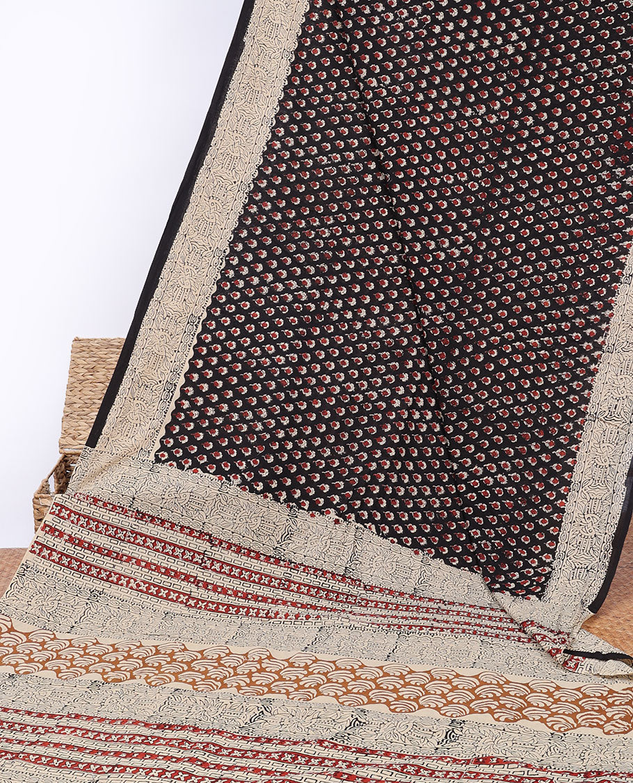 Black floral motifs printed mul-mul cotton saree, fish printed border & pallu of intricate print 