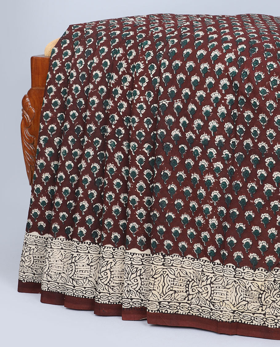 Brown floral motifs printed mul-mul cotton saree, fish printed border & pallu of intricate print 