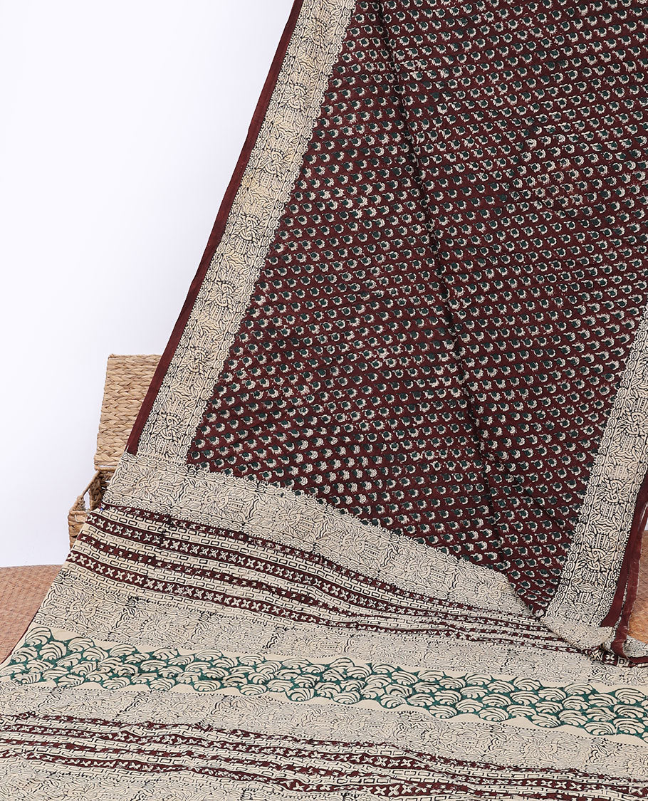 Brown floral motifs printed mul-mul cotton saree, fish printed border & pallu of intricate print 