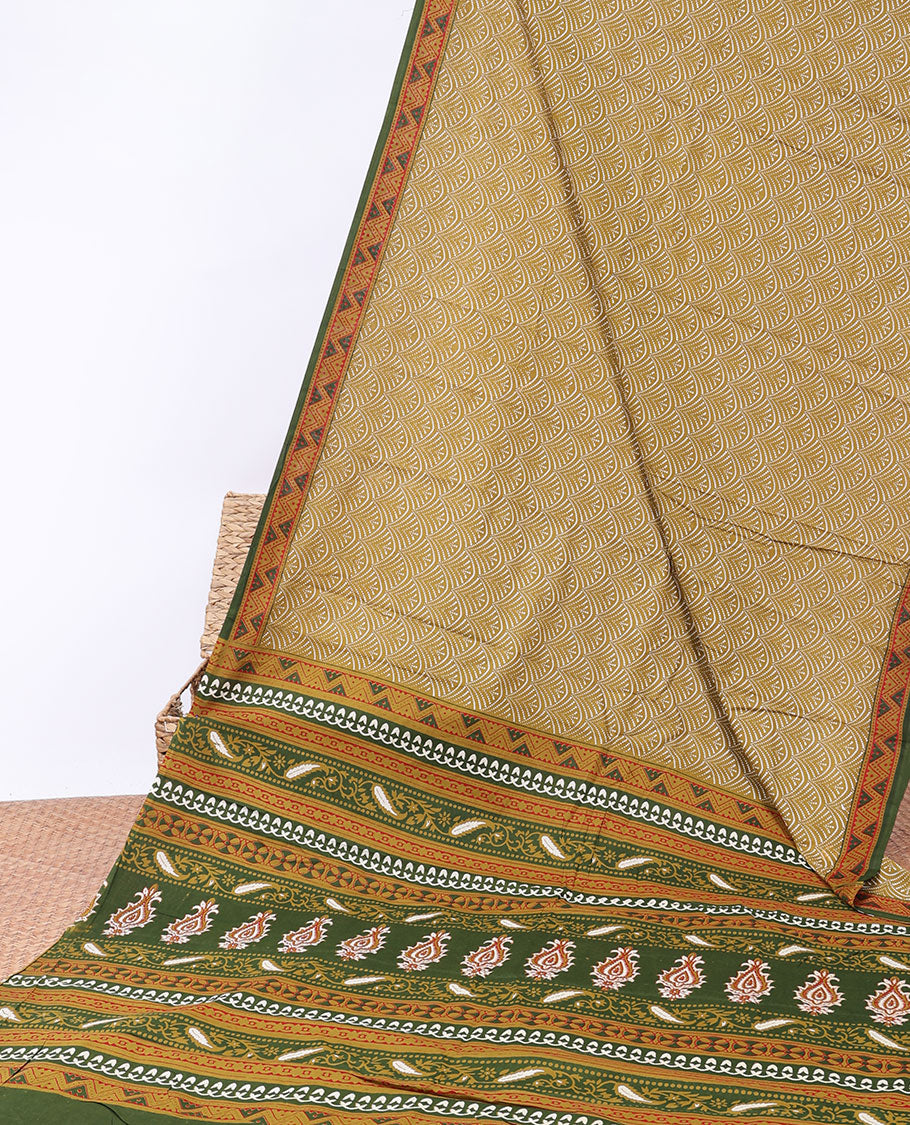 Mustard scallop printed mul-mul cotton saree, contrast chevron printed border & pallu of intricate print 