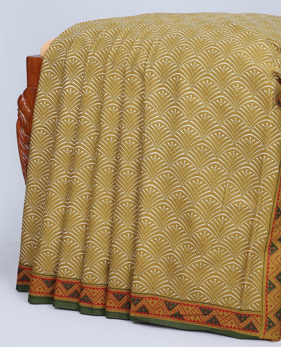 Mustard scallop printed mul-mul cotton saree, contrast chevron printed border & pallu of intricate print 