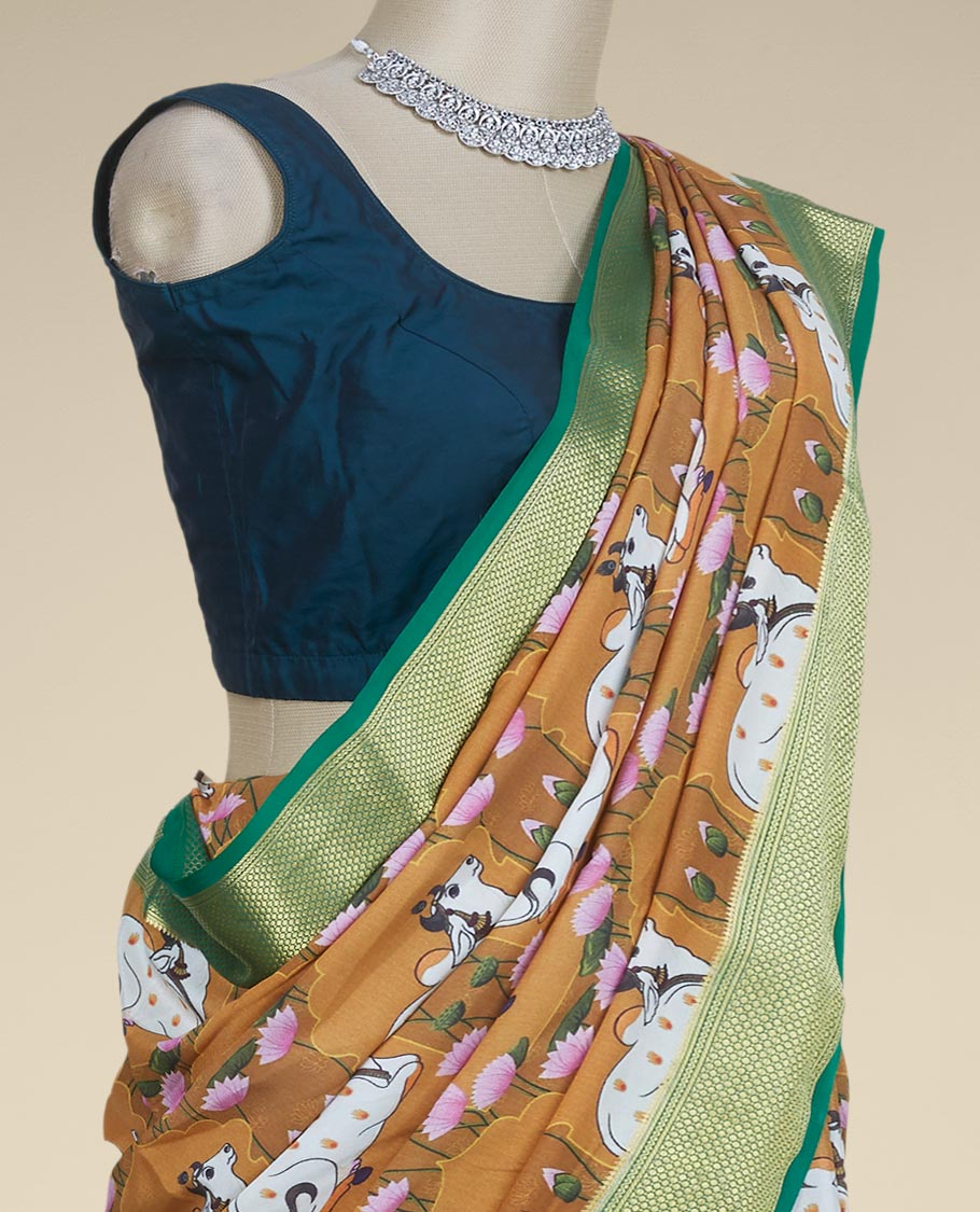 Mustard pichwai cows & lotus motifs printed mysore silk saree, contrast traditional design border