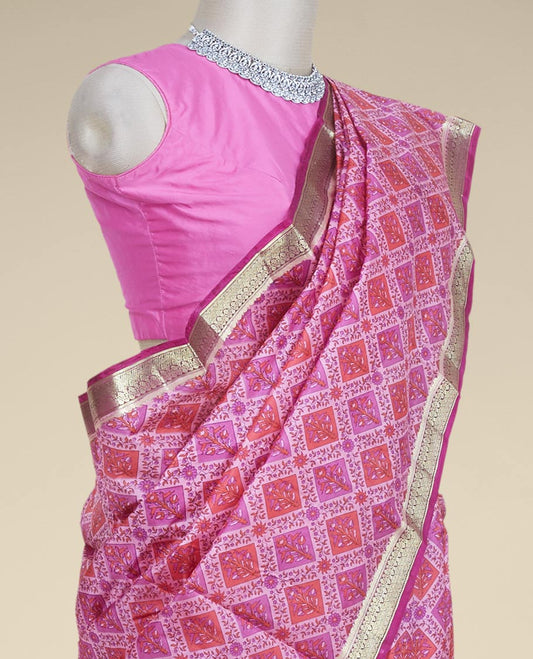 Pink floral butta enclosed diamond patterns printed silk saree, contrast traditional zari border