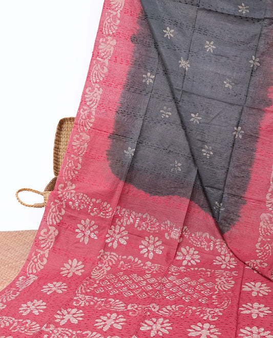 Grey linen cotton saree with batik-style floral buttas, contrast border & pallu of batik printed