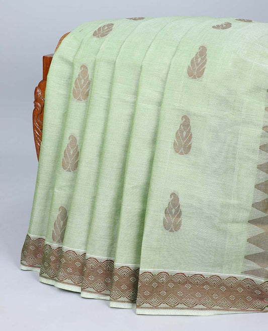 Green coimbatore cotton saree with buttas, self-border & pallu of floral & geometric designs