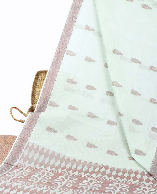 Pale green coimbatore cotton saree with buttas, self-border & pallu of floral & geometric designs