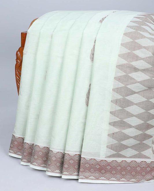 Pale green coimbatore cotton saree with buttas, self-border & pallu of floral & geometric designs