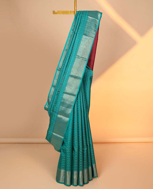 Blue checked silk saree, contrast jaal pallu & border of thilakam mokku,kathir,muthu,mayil chakram