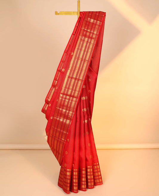 Red checked silk saree with mayil chakram buttas, jaal pallu & border steeped with traditional designs