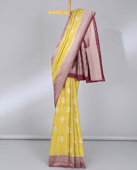 Yellow crushed tissue saree with buttas, contrast traditional design border & intricate pallu