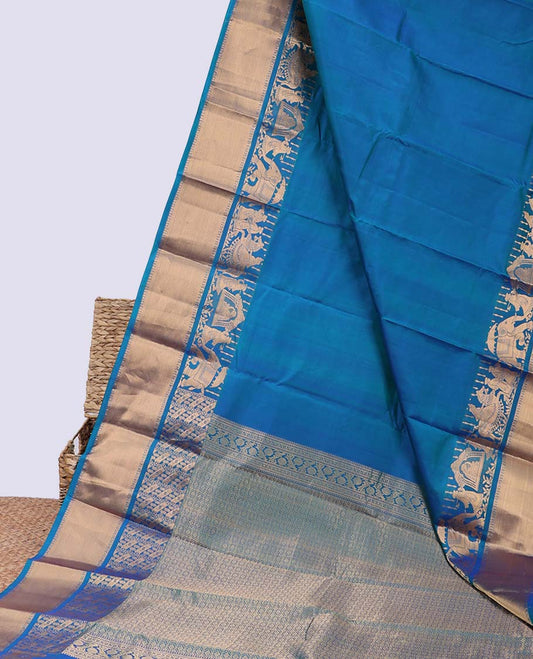 Blue plain silk saree, intricate pallu & weeding-themed figurines zari woven border of rekku & poun designs