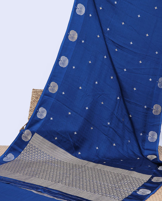 Blue mushru silk saree with buttas, floral design border & pallu of ogee pattern