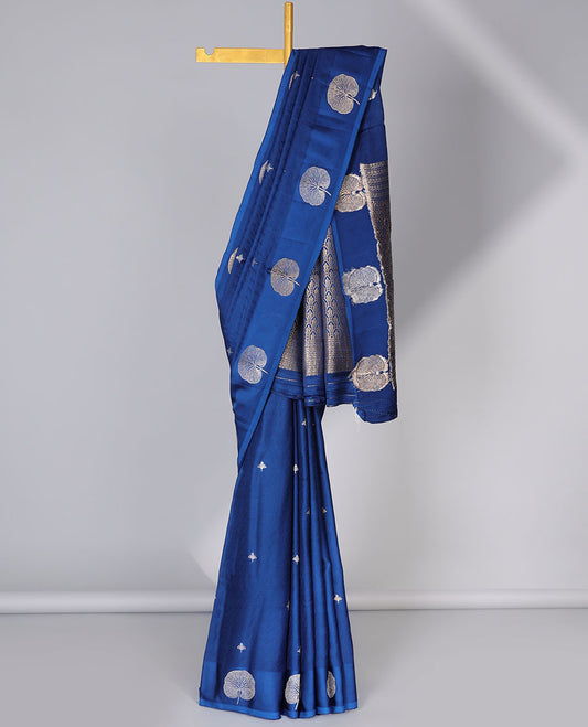 Blue mushru silk saree with buttas, floral design border & pallu of ogee pattern