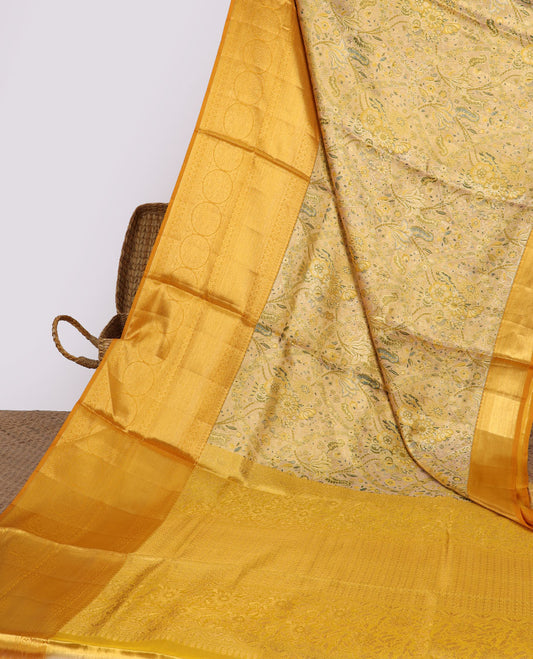 Yellow floral jacquard silk saree, contrast intricate pallu & border of diamond,kathir,mayil kann,jadai nagam & chakram