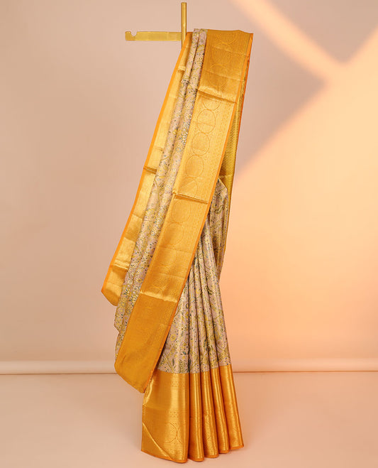 Yellow floral jacquard silk saree, contrast intricate pallu & border of diamond,kathir,mayil kann,jadai nagam & chakram