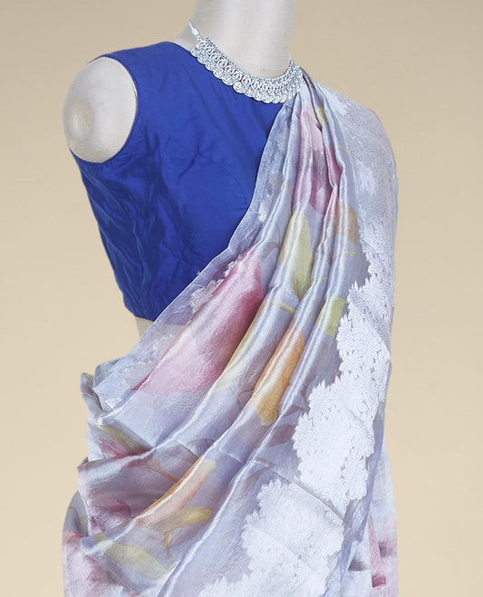 Grey colorful floral printed tissue silk saree, zari border steeped with floral designs