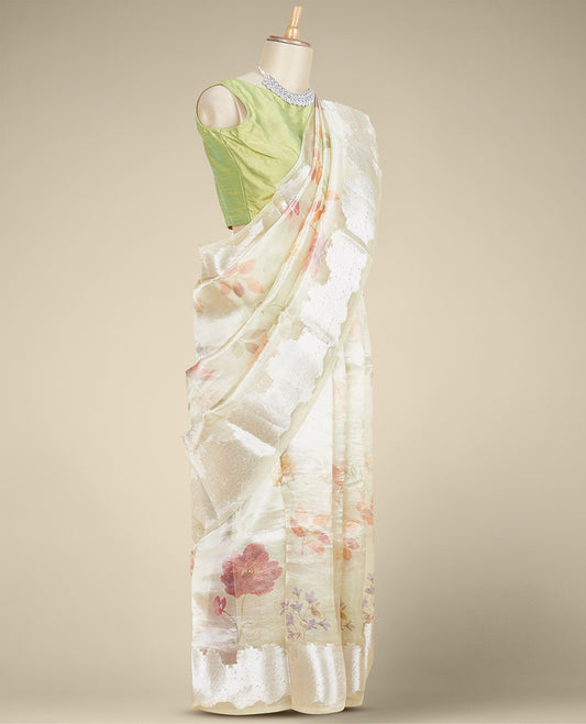 Green colorful floral printed tissue silk saree, zari border steeped with floral designs