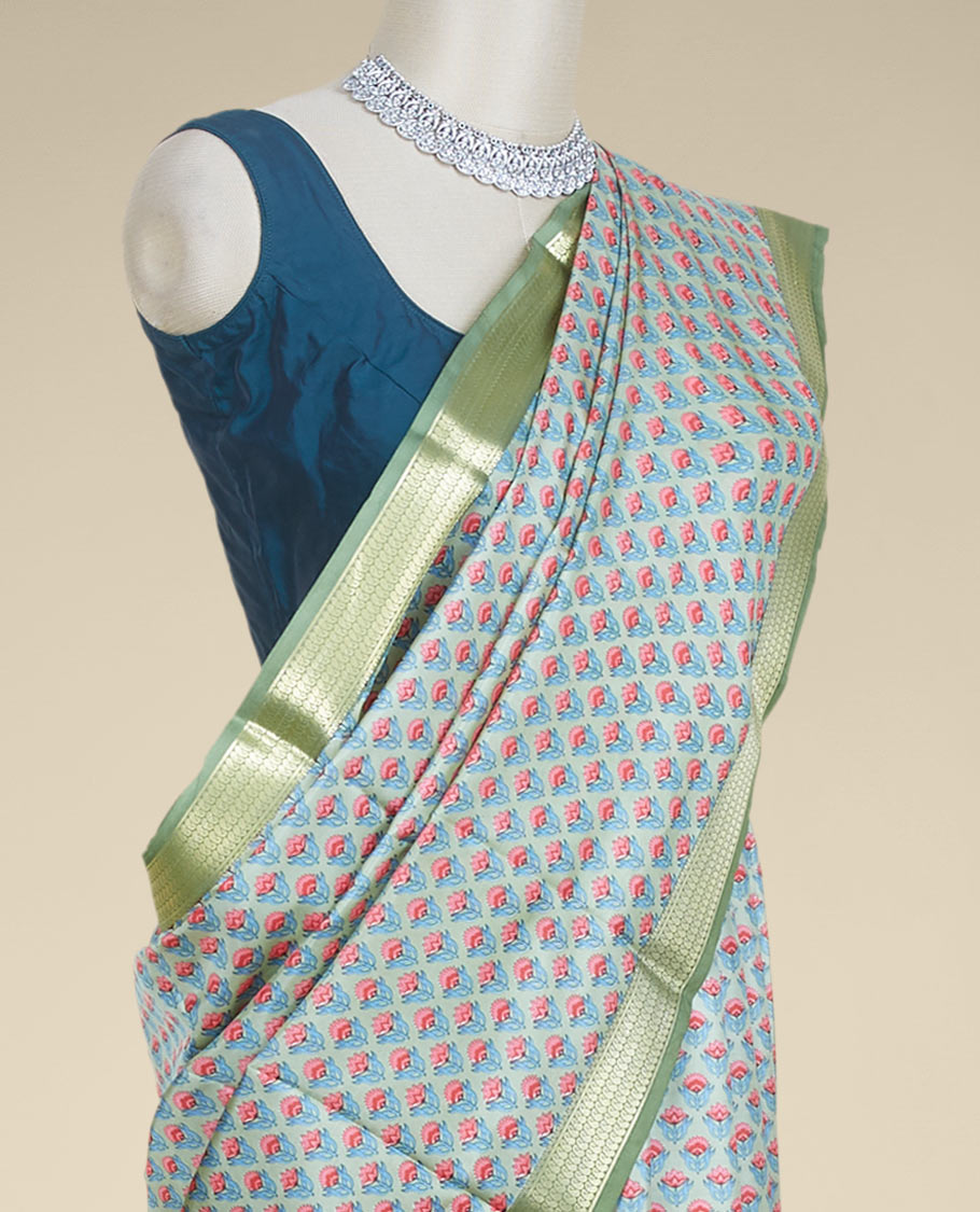 Green floral motifs printed silk saree, contrast zari border steeped with paisley designs