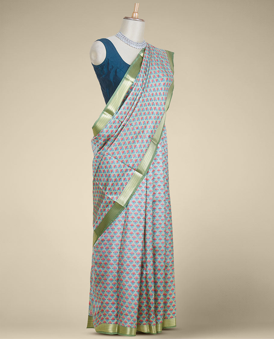 Green floral motifs printed silk saree, contrast zari border steeped with paisley designs