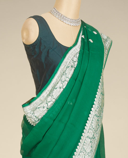 Green banaras georgette saree with buttas, traditional border with floral creeper designs