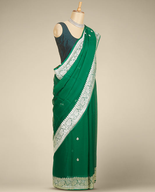 Green banaras georgette saree with buttas, traditional border with floral creeper designs
