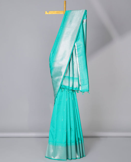 Turquoise semi-banaras dola silk saree with buttas, zari-rich traditional temple border, and pallu