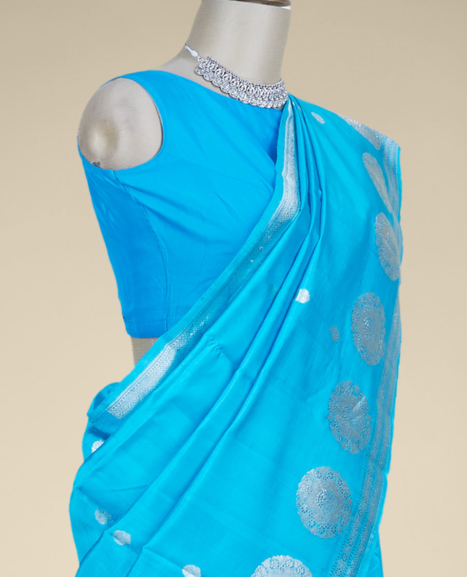 Blue banaras raw mango silk saree with zari buttas, zari border adorned with traditional designs
