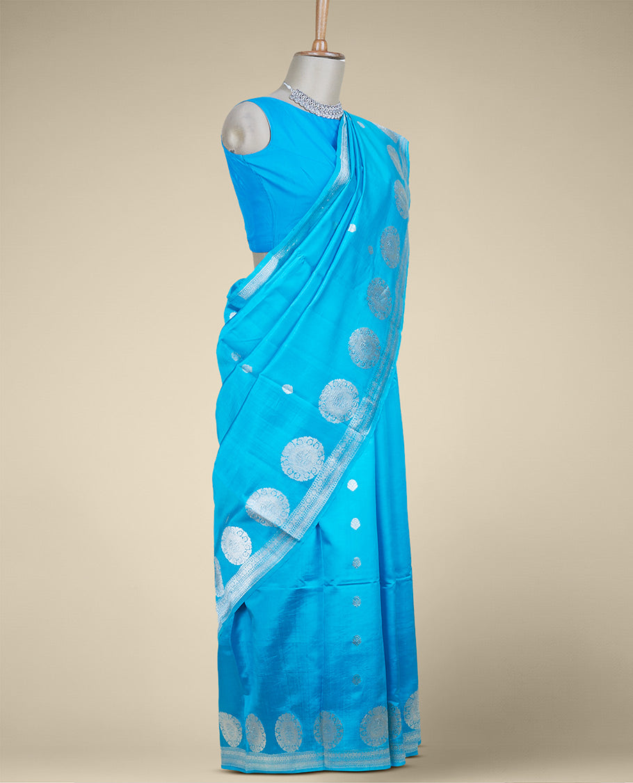 Blue banaras raw mango silk saree with zari buttas, zari border adorned with traditional designs