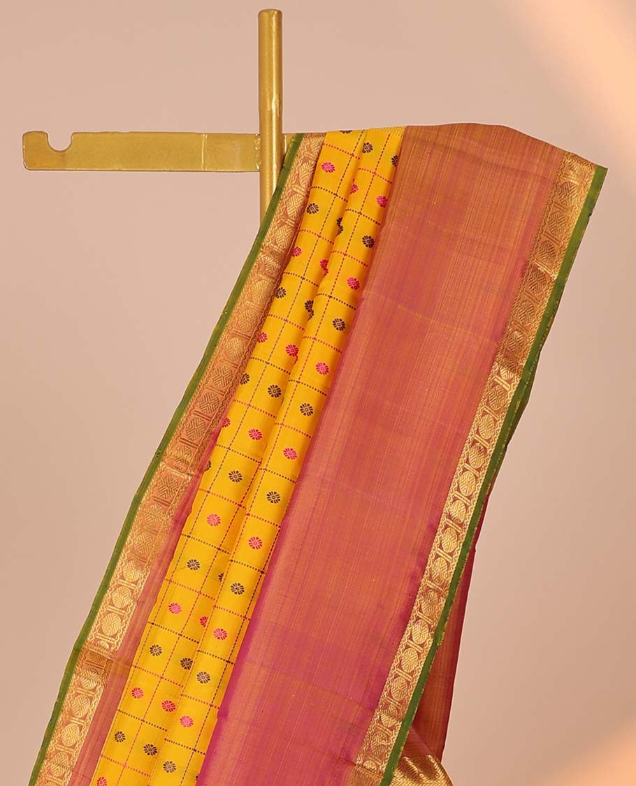 Yellow butta & check kancheepuram silksaree,contrast mayil chakra pallu & rettai petty border of rekku,neli,manga & poun