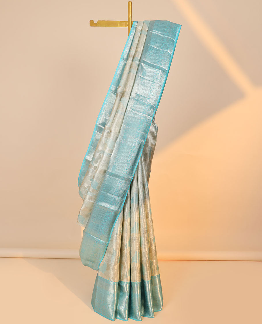 Grey jacquard kancheepuram tissue silk saree, contrast border of thilakam,poun & mayil kann & intricate pallu