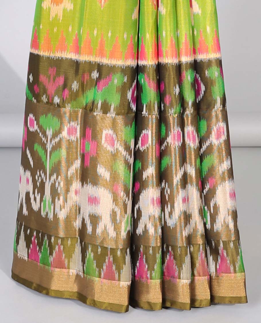 Green ikkat jaal design soft silk saree, contrast elephant motifs border & pallu of intricate ikkat designs