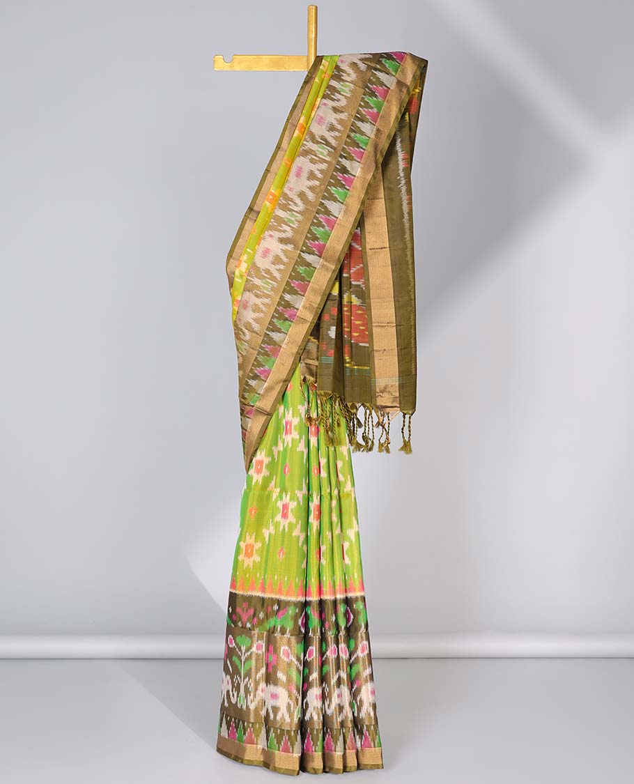 Green ikkat jaal design soft silk saree, contrast elephant motifs border & pallu of intricate ikkat designs