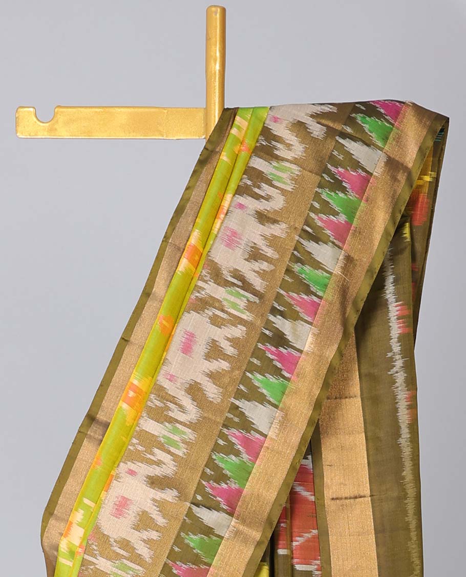 Green ikkat jaal design soft silk saree, contrast elephant motifs border & pallu of intricate ikkat designs
