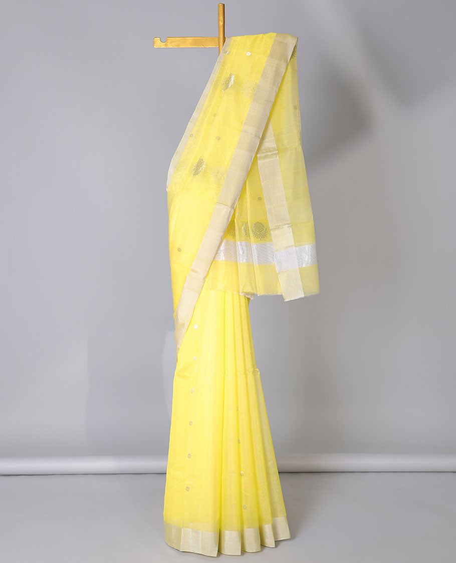 Yellow Chanderi cotton saree with buttas, plain border & floral zari design pallu