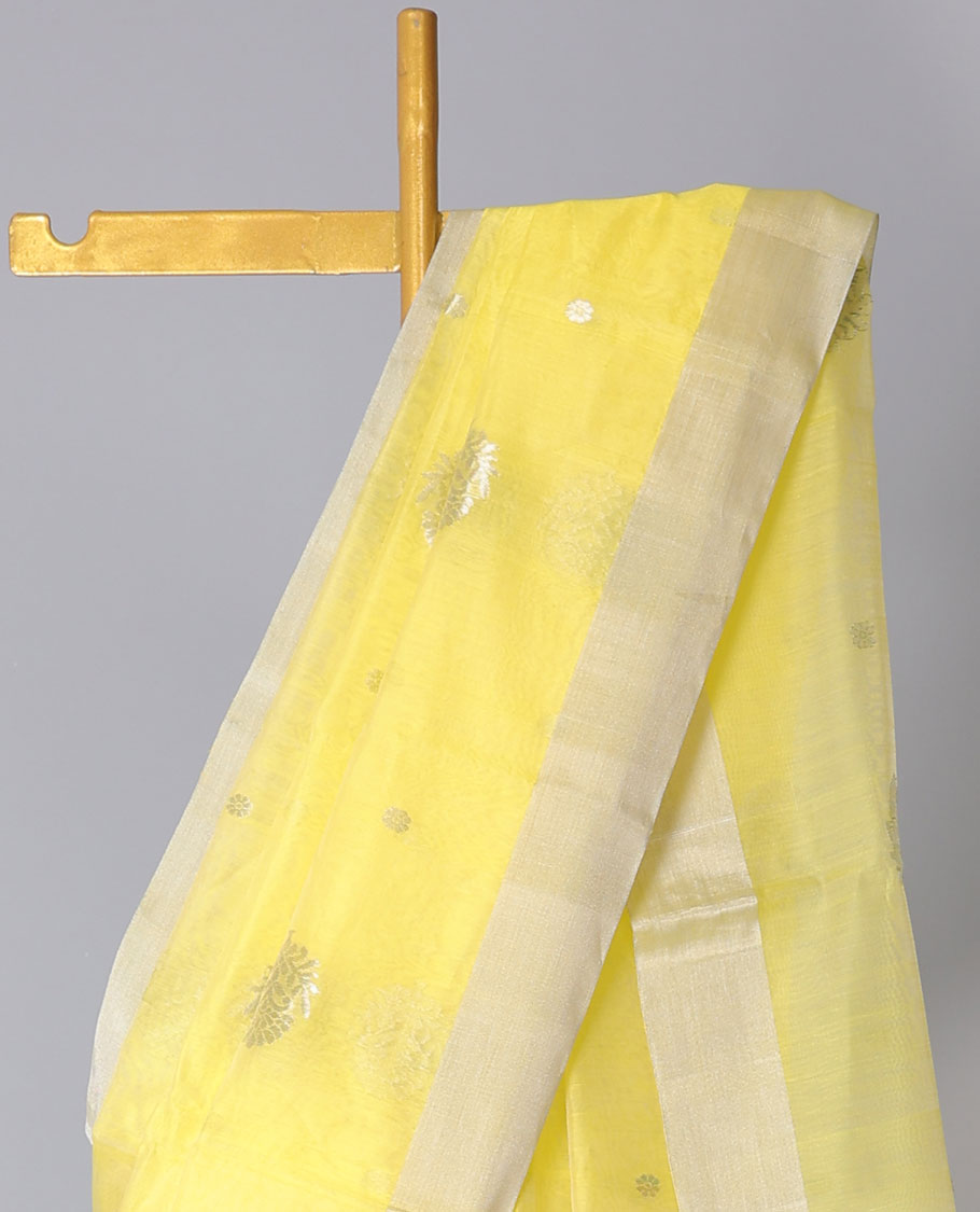 Yellow Chanderi cotton saree with buttas, plain border & floral zari design pallu
