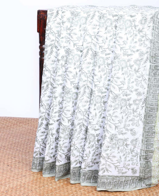 Cream floral printed mul-mul cotton saree, self-border & pallu of elephant motifs print
