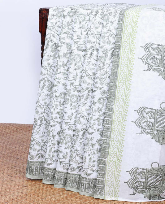 Cream floral printed mul-mul cotton saree, self-border & pallu of elephant motifs print