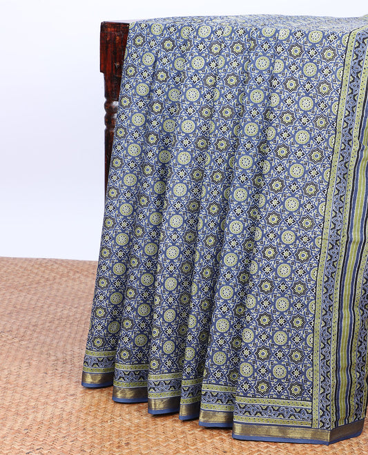 Blue ajrakh-style printed mul-mul cotton saree, self-border & intricately printed pallu