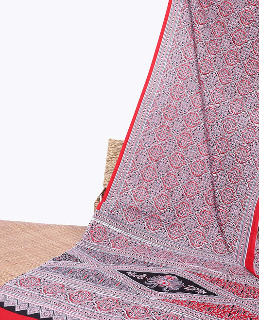 Red ajrakh printed mul-mul cotton saree, geometric printed border & intricately printed pallu