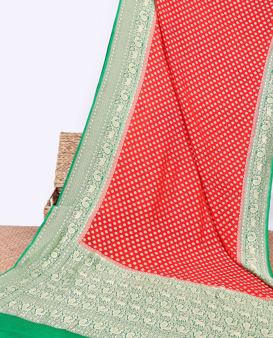 Red khaddi georgette saree with buttas, contrast intricate pallu & border steeped with traditional designs