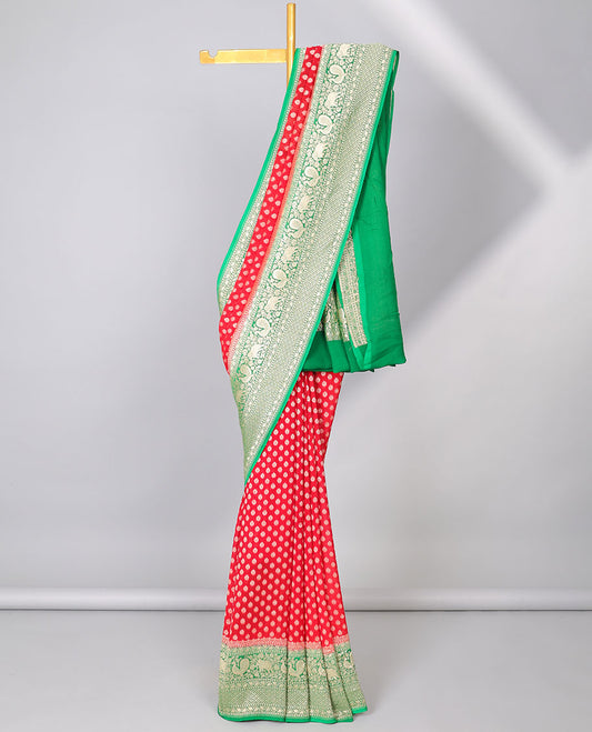 Red khaddi georgette saree with buttas, contrast intricate pallu & border steeped with traditional designs