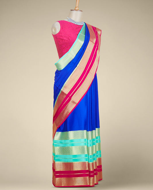 Blue plain mysore silk saree, contrast dual-colored big border steeped with traditional zari designs