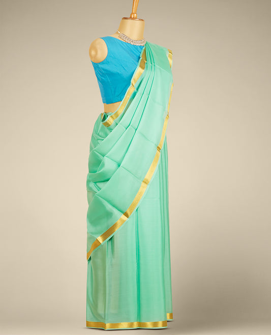 Green plain design mysore silk saree, zari border of traditional designs
