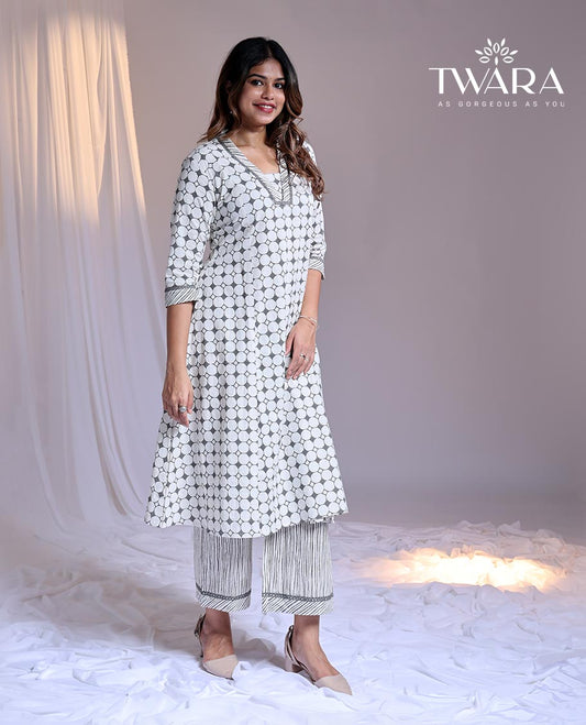 Twara White readymade suit, geometric printed 3/4th sleeve v-neck cotton top & printed pants