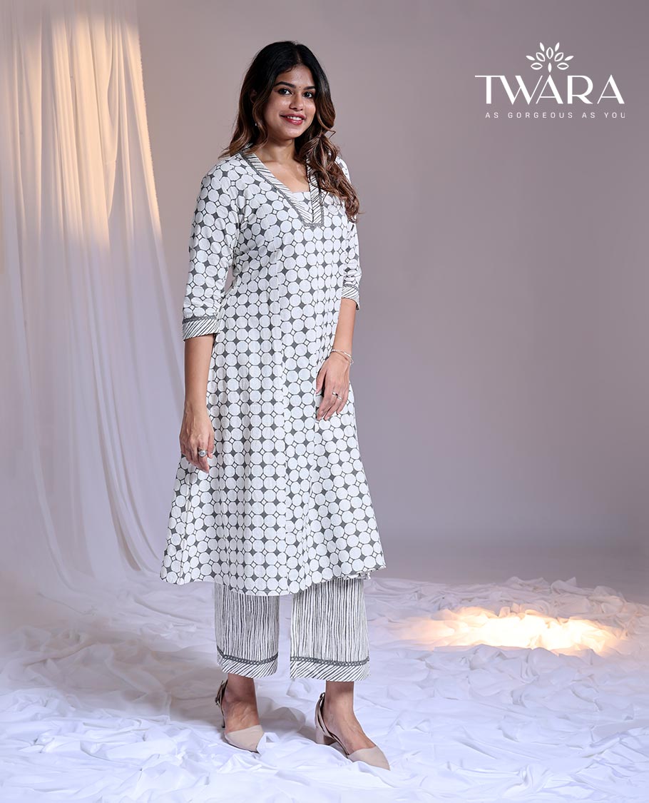 Twara White readymade suit, geometric printed 3/4th sleeve v-neck cotton top & printed pants