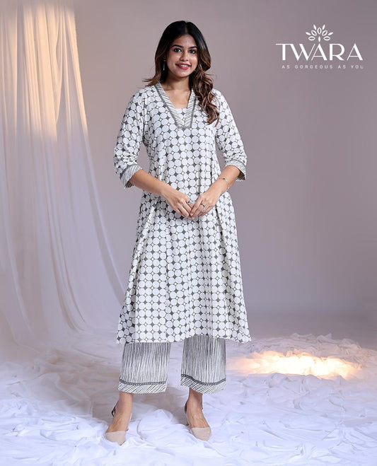 Twara White readymade suit, geometric printed 3/4th sleeve v-neck cotton top & printed pants