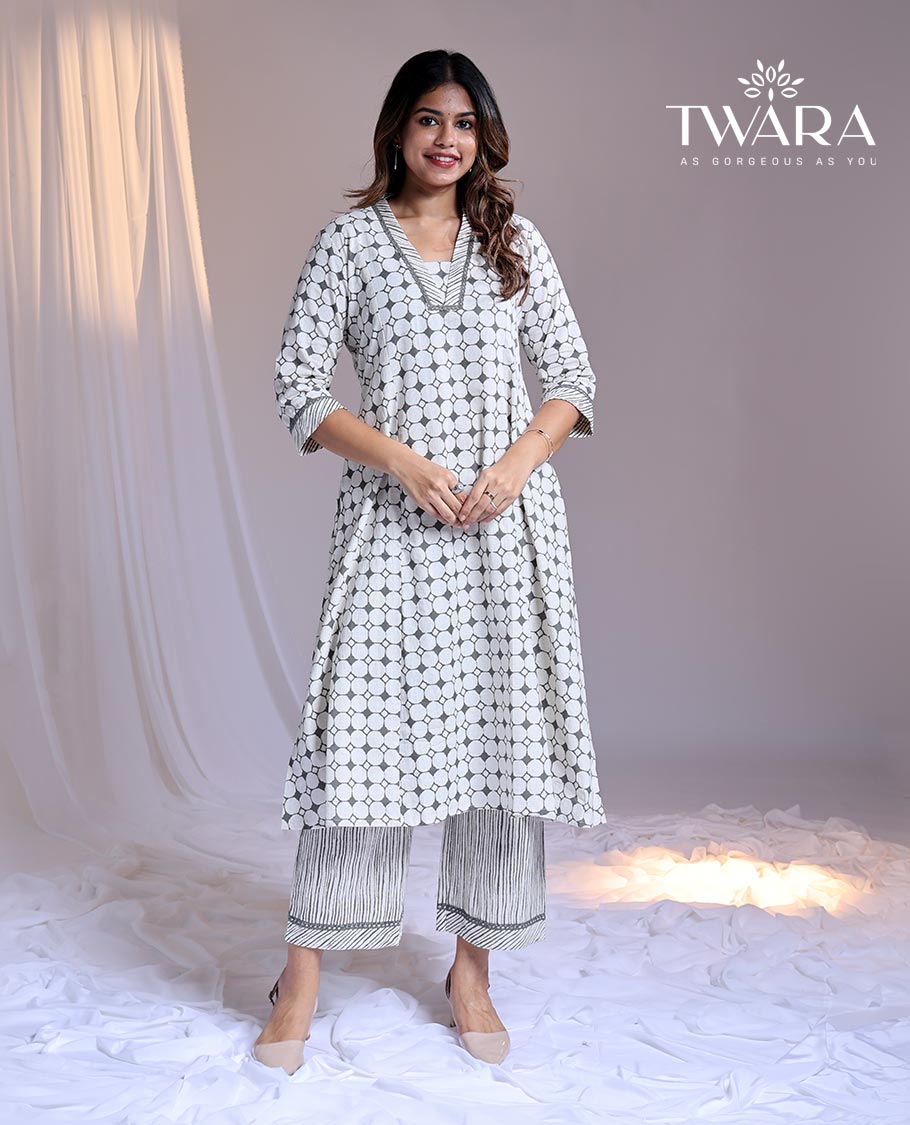Twara White readymade suit, geometric printed 3/4th sleeve v-neck cotton top & printed pants