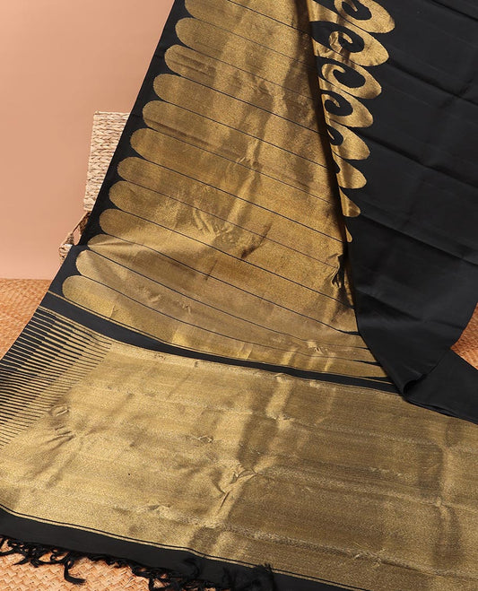 Borderless black kanchipuram designer silk saree features paisleys, zari-rich pallu adorned with seppu rekku design