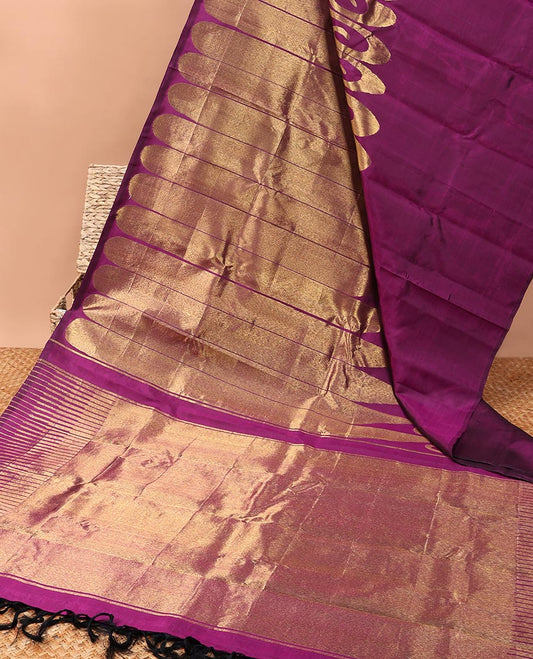 Borderless purple kanchipuram designer silk saree features paisleys, zari-rich pallu adorned with seppu rekku design